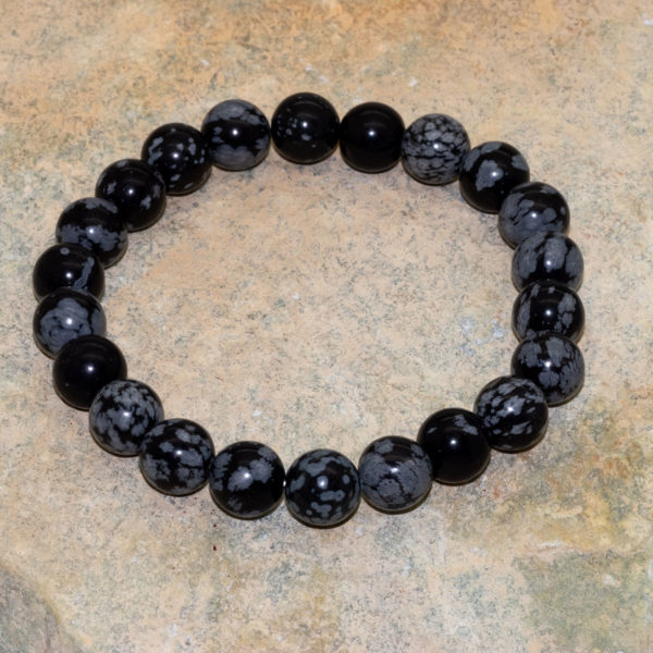 Snöflingeobsidian- armband.  8 mm runda stenar